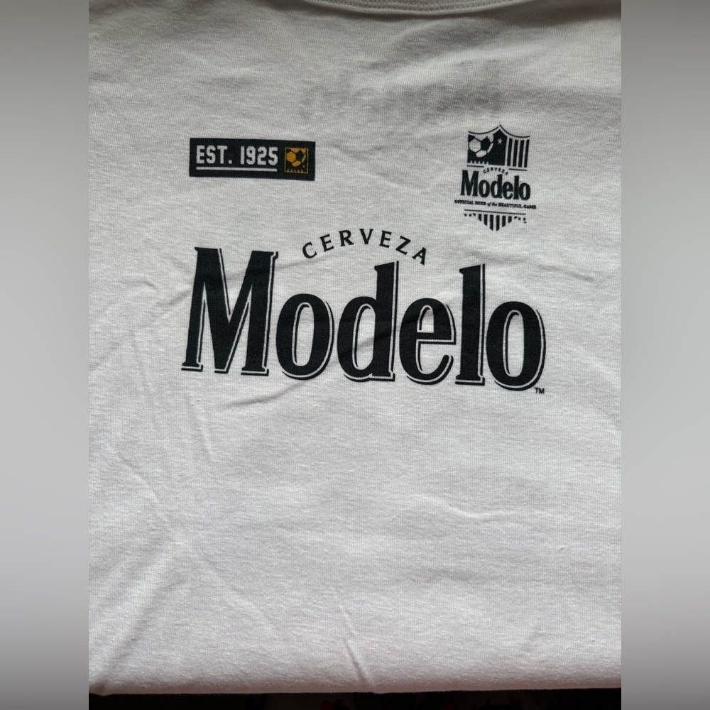 nwot-MODELO Beer 
Baby Doll
White Cerveza Graphic T-Shirt
Crewneck short sleeve
